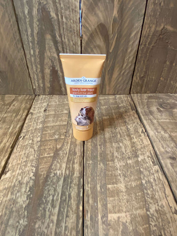 The photo shows a tube of Arden Grange Liver Paste against a wooden background