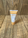 The photo shows the back of a tube of Arden Grange Liver Paste against a wooden background